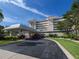 Welcoming entrance features porte cochere, manicured landscaping and easy parking access at 1150 Tarpon Center Dr # 3G 307, Venice, FL 34285