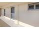Exterior hallway with tile flooring, a door, and a window at 1150 Tarpon Center Dr # 3G 307, Venice, FL 34285