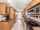 Efficient kitchen layout featuring stainless steel appliances, ample counter space, and tile backsplash at 1150 Tarpon Center Dr # 3G 307, Venice, FL 34285