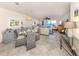 Inviting living area with comfortable seating, leading to a balcony with ocean views at 1150 Tarpon Center Dr # 3G 307, Venice, FL 34285
