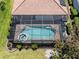 Aerial view of pool and spa within enclosure at 11610 Dancing River Dr, Venice, FL 34292