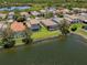 Waterfront homes featuring screened lanais and pristine landscaping within a vibrant community at 11610 Dancing River Dr, Venice, FL 34292