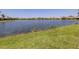 Lawn gently slopes down to the picturesque lake at 11610 Dancing River Dr, Venice, FL 34292