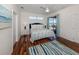 Serene main bedroom boasting a comfortable bed and sliding door access to the outdoor pool at 11610 Dancing River Dr, Venice, FL 34292