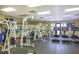 Well-equipped fitness center featuring modern exercise machines and a mirrored wall at 11610 Dancing River Dr, Venice, FL 34292
