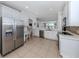Well-appointed kitchen featuring modern appliances and a view of the backyard at 11610 Dancing River Dr, Venice, FL 34292