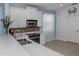 Bright kitchen with stainless steel appliances, white cabinets, and stylish backsplash at 11610 Dancing River Dr, Venice, FL 34292