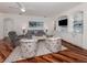 Cozy living room with built-in shelving, entertainment center, and plush seating at 11610 Dancing River Dr, Venice, FL 34292