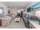Comfortable living room with hardwood floors, stylish furniture, and plenty of natural light at 11610 Dancing River Dr, Venice, FL 34292
