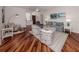 Bright and airy living room with hardwood floors and coastal-themed decor at 11610 Dancing River Dr, Venice, FL 34292