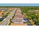Aerial view of a residential neighborhood showcasing well-maintained homes and lush landscaping at 11711 Alessandro Ln, Venice, FL 34293