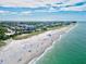 Aerial view of beach featuring clear waters, a sandy shore, and picturesque coastline of a desirable location at 11711 Alessandro Ln, Venice, FL 34293