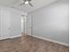 Spacious bedroom with tile floors and multiple closets, offering plenty of storage space at 11711 Alessandro Ln, Venice, FL 34293