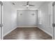 Spacious bedroom featuring wood-look tile flooring, neutral walls, and bright natural light at 11711 Alessandro Ln, Venice, FL 34293