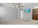 Large bedroom with a closet, en suite bathroom, and a view of a built in wooden dresser at 11711 Alessandro Ln, Venice, FL 34293