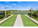 Community bocce ball court with a beautiful view of the lake in the background at 11711 Alessandro Ln, Venice, FL 34293