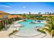 Community pool area with plenty of lounge chairs and shade, great for relaxation at 11711 Alessandro Ln, Venice, FL 34293
