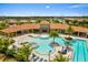 Resort-style community pool featuring a large pool, a spa, and plenty of lounge chairs at 11711 Alessandro Ln, Venice, FL 34293