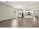 Open-concept living area next to a kitchen with hard flooring and bright interiors at 11711 Alessandro Ln, Venice, FL 34293
