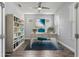 Bright and airy office space with built-in shelving and a stylish desk, perfect for productivity at 11711 Alessandro Ln, Venice, FL 34293