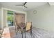 Screened-in patio featuring neutral tones, decorative wall clock, and tiled floors at 11711 Alessandro Ln, Venice, FL 34293