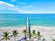 Breathtaking aerial view of a pier extending into the ocean on a sunny day at 11711 Alessandro Ln, Venice, FL 34293