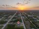 Community aerial view with pin drop showing location during sunset at 12199 Xavier Ave, Port Charlotte, FL 33981