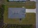 Birds eye view of house, roof, lawn and driveway at 12199 Xavier Ave, Port Charlotte, FL 33981