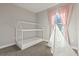 Bright bedroom featuring a bed frame, play tent, pink curtains, and plush carpet at 12199 Xavier Ave, Port Charlotte, FL 33981