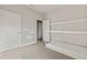 Charming bedroom with a bed frame, decorative shelves, and neutral walls at 12199 Xavier Ave, Port Charlotte, FL 33981