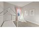 Playful bedroom featuring a bed frame, teepee, soft pink curtains, and natural light at 12199 Xavier Ave, Port Charlotte, FL 33981