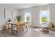 Contemporary dining room with modern furnishings, natural light, and stylish decor at 12199 Xavier Ave, Port Charlotte, FL 33981
