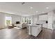 Bright open-concept space integrating a modern kitchen, dining, and living area with ample light at 12199 Xavier Ave, Port Charlotte, FL 33981