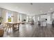 Open-concept living area featuring a dining space, modern furnishings, and abundant windows at 12199 Xavier Ave, Port Charlotte, FL 33981