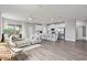 Spacious living area flowing into the kitchen, with modern finishes and plenty of natural light at 12199 Xavier Ave, Port Charlotte, FL 33981