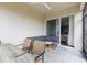 Cozy covered patio with seating area and dining space, ideal for enjoying outdoor living at 12199 Xavier Ave, Port Charlotte, FL 33981