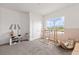 Inviting playroom with neutral carpet, climbing frame, and toys illuminated by natural light streaming through a wide window at 12199 Xavier Ave, Port Charlotte, FL 33981