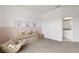 Open playroom featuring gray carpet, organized toy storage, with easy access to an adjacent bathroom at 12199 Xavier Ave, Port Charlotte, FL 33981