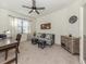 Versatile home office with a desk, futon sofa, and decorative accents at 12515 Felice Dr, Venice, FL 34293