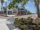 Beautiful view of downtown street with benches, plantings, and storefronts to add community appeal at 12515 Felice Dr, Venice, FL 34293