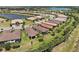 Scenic aerial view of homes in a lake community featuring lush landscaping and waterfront properties at 12897 Oriago St, Venice, FL 34293