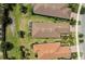 Aerial view of homes showcasing well-manicured lawns,tile roofs, landscaping, and community layout at 12897 Oriago St, Venice, FL 34293