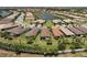 Scenic aerial view of homes in a lake community featuring lush landscaping and waterfront properties at 12897 Oriago St, Venice, FL 34293