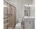 Bathroom showcasing a vanity and a shower with a sliding glass door at 12897 Oriago St, Venice, FL 34293
