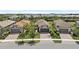 Charming single-Gathering homes with two car garages, brick driveways, and well-manicured lawns at 12897 Oriago St, Venice, FL 34293