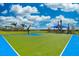 Community basketball court and playground offers residents opportunities for exercise and social activities at 13202 Borrego St, Venice, FL 34293