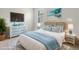 Bright bedroom with blue accents, patterned rug, and modern furniture at 13202 Borrego St, Venice, FL 34293