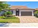 Charming single-Gathering home with two-car garage, and brick-paved driveway at 13202 Borrego St, Venice, FL 34293
