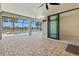 Outdoor lanai featuring brick pavers, ceiling fans, outdoor TV, and pool at 13202 Borrego St, Venice, FL 34293
