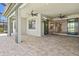 Open-air patio with neutral pavers and easy access to the indoors at 13202 Borrego St, Venice, FL 34293